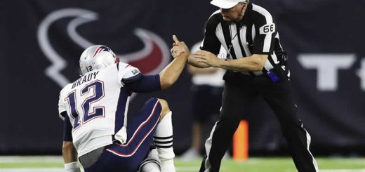 Referee helps Tom Brady up
