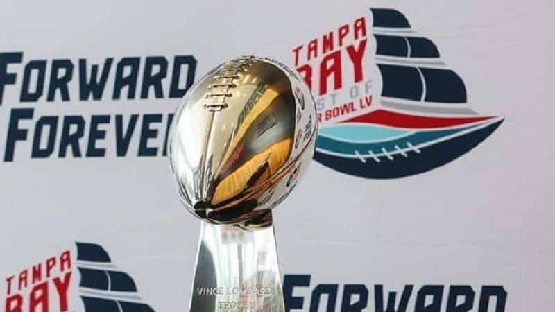 nfl super bowl trophy in front of new tampa bay sb lv logo