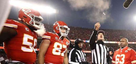 referee performing Super Bowl LV coin toss with Chiefs watching