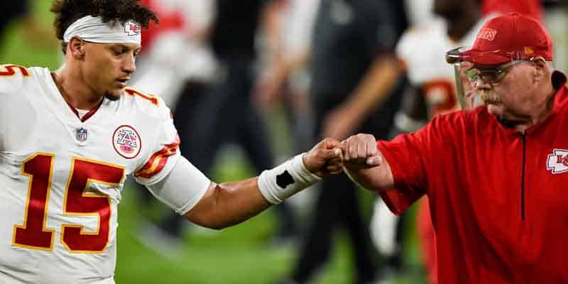 Patrick Mahomes and Andy Reid fist bumping