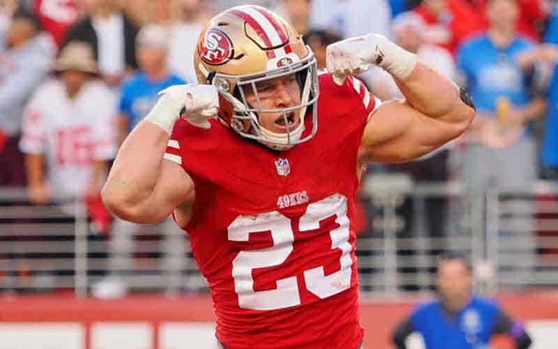 San Francisco 49ers running back Christian McCaffrey flexing his muscles